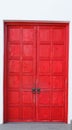 Red vintage retro wooden door on white wall background. Home interior architecture design, plain tropical textured wood panel Royalty Free Stock Photo