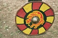 Red vintage shield with yellow animal lion a medieval warrior. Reconstruction of the events of the Middle Ages in Europe