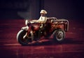 Red vintage toy byke on dark wooden table Royalty Free Stock Photo