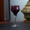 Red vintage wine glass close-up. antique wine glass Royalty Free Stock Photo