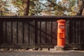 Red vintgae Japanese mail letter postbox and black wooden wall