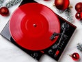 A red vinyl record player sitting on top of a table Royalty Free Stock Photo