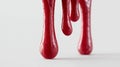 Red viscous liquid dripping against a white background Royalty Free Stock Photo