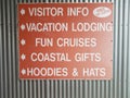 Red visitor information, hot free coffee, vacation lodging sign Royalty Free Stock Photo