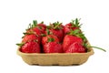 Red vivid ripe strawberries laying in organic brown cardboard pallet box Royalty Free Stock Photo