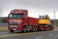 Red Volvo FH16 750 Transports Crawler Excavator in the Evening