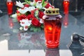 Red votive candle on the grave. Day of the dead Royalty Free Stock Photo