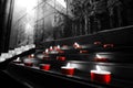Red votive candles church tealights selective color black and white Royalty Free Stock Photo