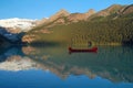 Red Voyageur Canoes on Lake Louise Royalty Free Stock Photo