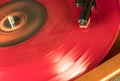 A Red Vynil Disc is being spinned in a player Royalty Free Stock Photo