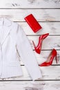 Red wallet and high heel shoes. Royalty Free Stock Photo