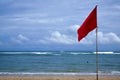 A red warning flag on the beach in the Nuca Dua Bali Royalty Free Stock Photo