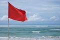 A red warning flag on the beach in the Nuca Dua Bali Royalty Free Stock Photo