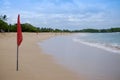 A red warning flag on the beach in the Nuca Dua Bali Royalty Free Stock Photo