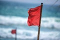 Red warning flag on beach Royalty Free Stock Photo