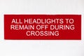 Red warning signboard on passenger ferry