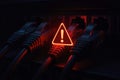 Red warning symbol over network cables connected to a server rack alert danger Royalty Free Stock Photo