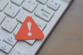 Red warning triangle on Enter key symbolizing system error, security alert, and urgent digital attention Royalty Free Stock Photo