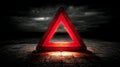 Red warning triangle with exclamation mark on dark, stormy background Royalty Free Stock Photo