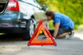 Red warning triangle sign on the road