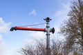 Red water faucet against the sky in the open air. Fire hydrant with faucet and shutoff valve. Royalty Free Stock Photo