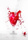 Red water spill from broken wine glass on a white background Royalty Free Stock Photo