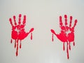 Red watercolor print of human hand on white background isolated close up Royalty Free Stock Photo