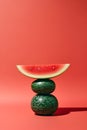 Red watermelon as an abstract balancing act, generative AI content