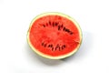Red Watermelon Fruit half Slice on Clean White Surface. Royalty Free Stock Photo