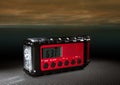 Red wather radio with threatening skies behind Royalty Free Stock Photo