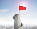 Red wavy flag on tower top with stairs