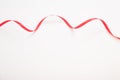 Red wavy ribbon on white