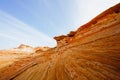 Red wavy sandstone formation of Glan Canyon National Recriation area, Page, Arizona. Bright blue sky background Royalty Free Stock Photo