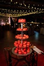 Red wedding cake with small heart-shaped mousse cakes Royalty Free Stock Photo