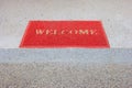 Red welcome carpet on staircase