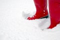 Red wellington boots in the snow Royalty Free Stock Photo