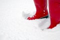 Red wellington boots in the snow