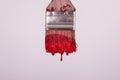 Red wet paint dripping from painters paintbrush Royalty Free Stock Photo