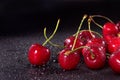 Red wet sweet cherries on black background Royalty Free Stock Photo