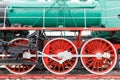 Red wheel and detail of mechanism a vintage russian steam train locomotive Royalty Free Stock Photo