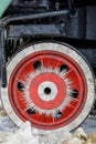 Red wheel and detail of mechanism a vintage russian steam train locomotive