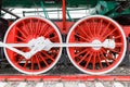 Red wheel and detail of mechanism a vintage russian steam train locomotive Royalty Free Stock Photo