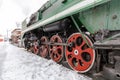 Red wheel and detail of mechanism a vintage russian steam train locomotive Royalty Free Stock Photo