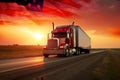 A red semi truck going down an interstate highway with sunrise ang America flag Royalty Free Stock Photo