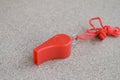 Red whistle on the floor