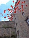 Red and white ballons in the blue sky in front of a castle Royalty Free Stock Photo