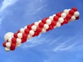 Red and white balloons isolated on blue sky background Royalty Free Stock Photo