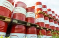 Red-white barrels with oil. Warehousing containers ready for shipment. Refining and selling oil derivatives Royalty Free Stock Photo
