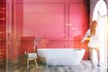 Red and white bathroom interior, tub, woman Royalty Free Stock Photo