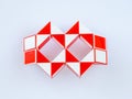 red and white bicolor magic snake Transformable twist puzzle in shape of carnival mask or glasses Royalty Free Stock Photo